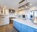 Beautiful white kitchen with large marble island.